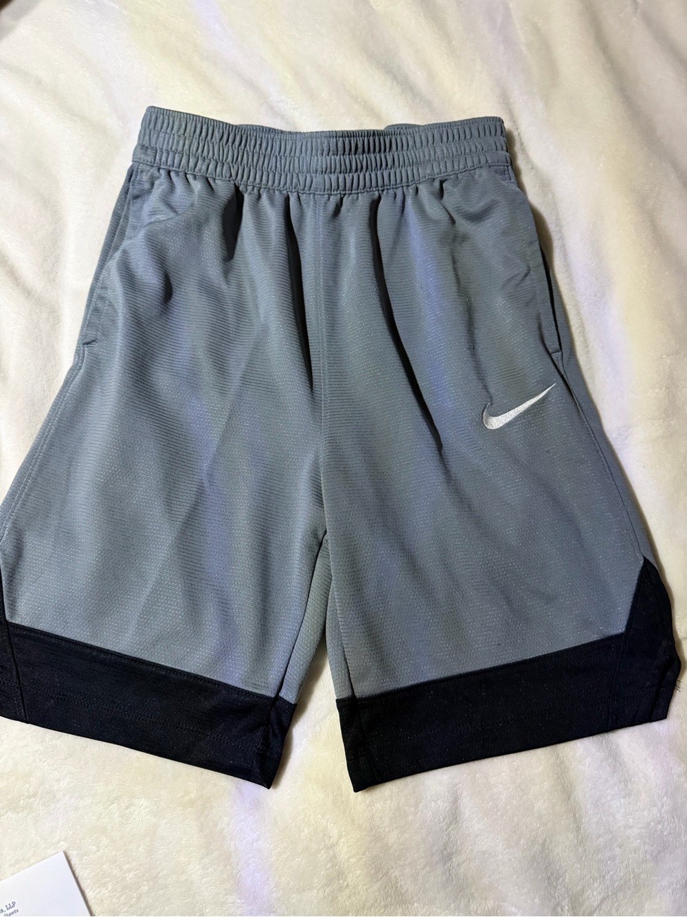Nike Grey Athletic Shorts with Black Hem and White Swoosh